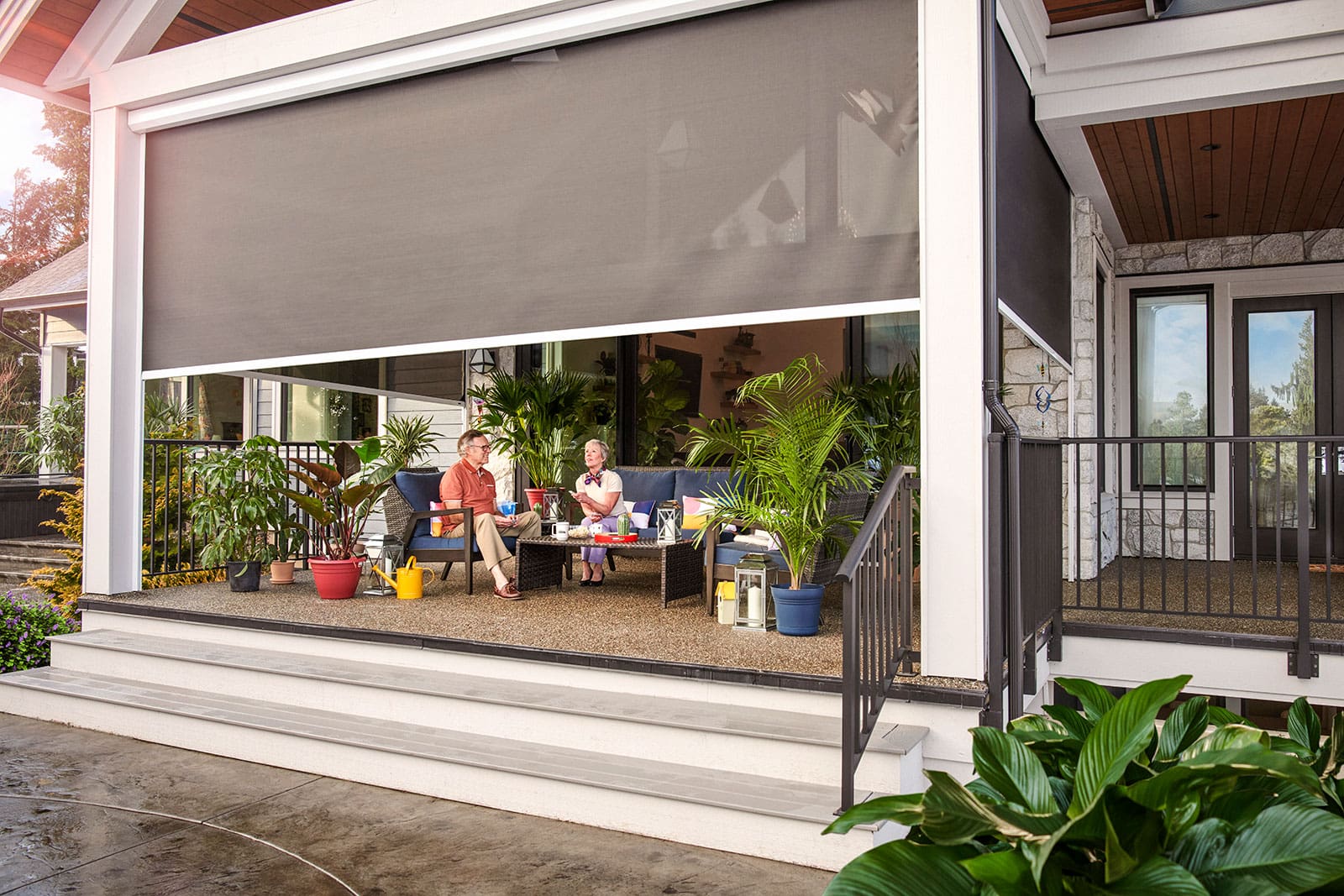 Phantom motorized screens surrounding a covered outdoor living space